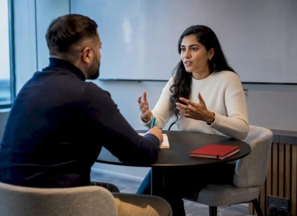 Professionals practising a sales role-play