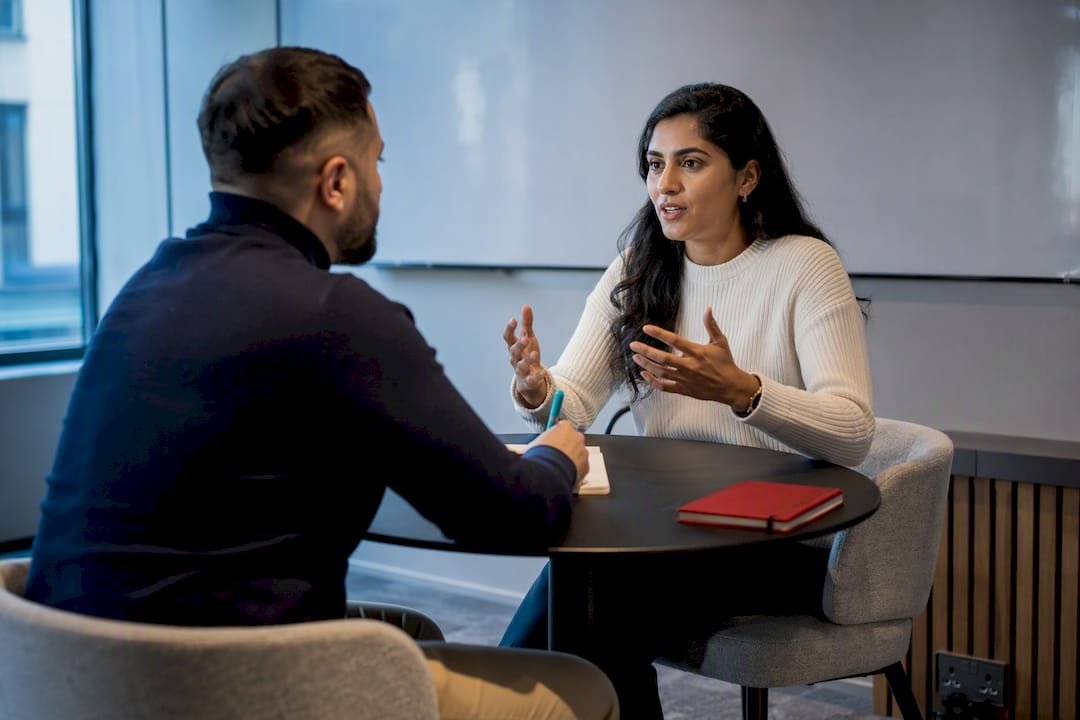 Professionals practising a sales role-play