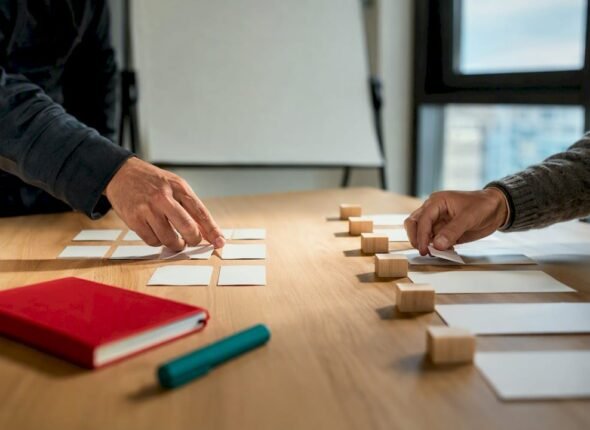 Professionals comparing Scrum and project planning materials