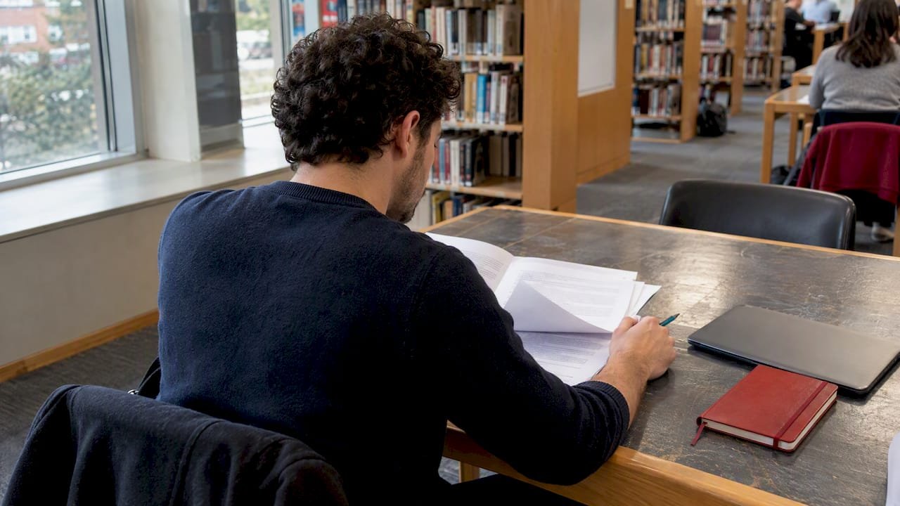 Adult preparing for sales certification exam