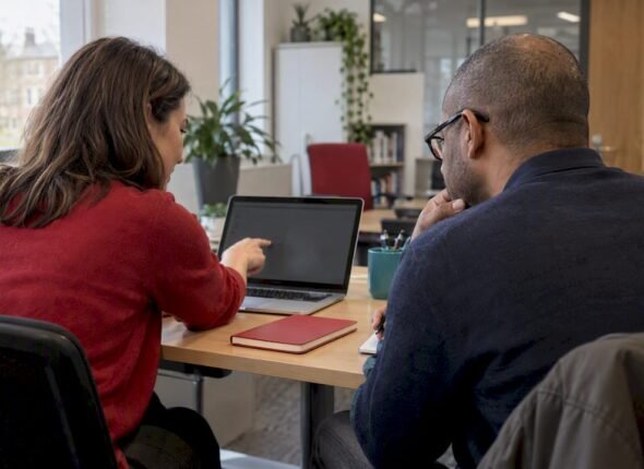 Professionals reviewing social media certifications