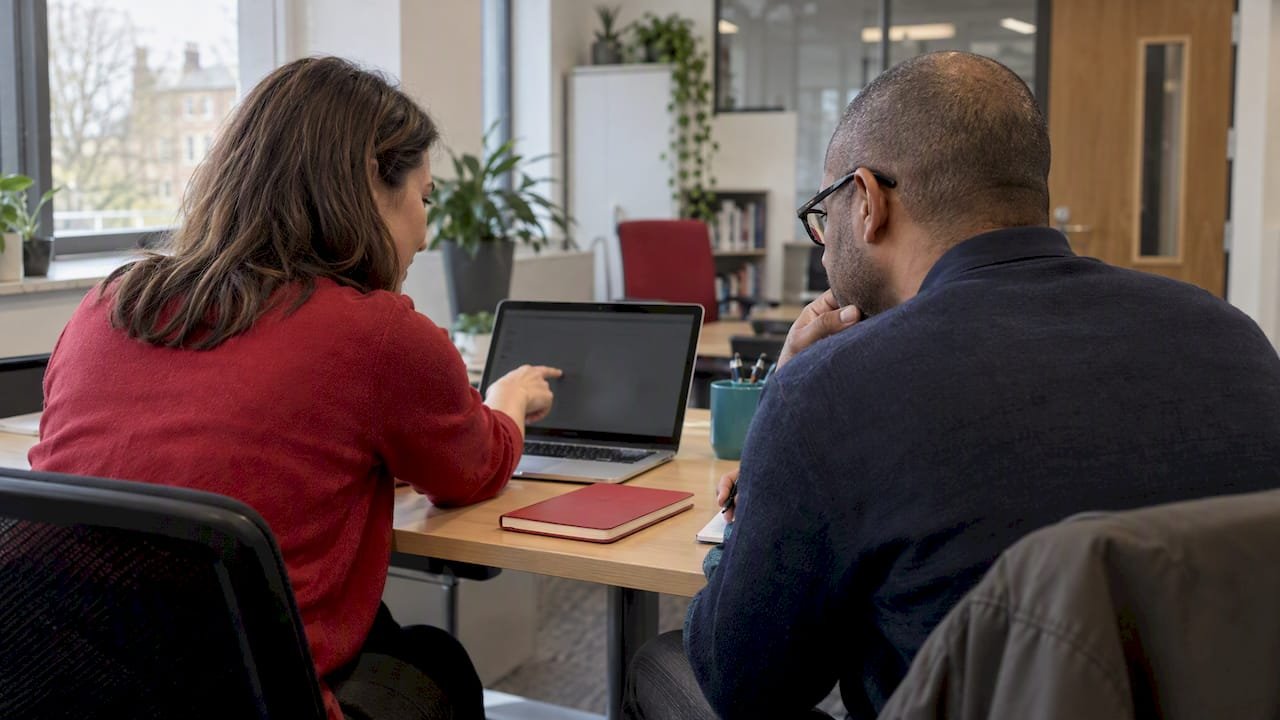 Professionals reviewing social media certifications