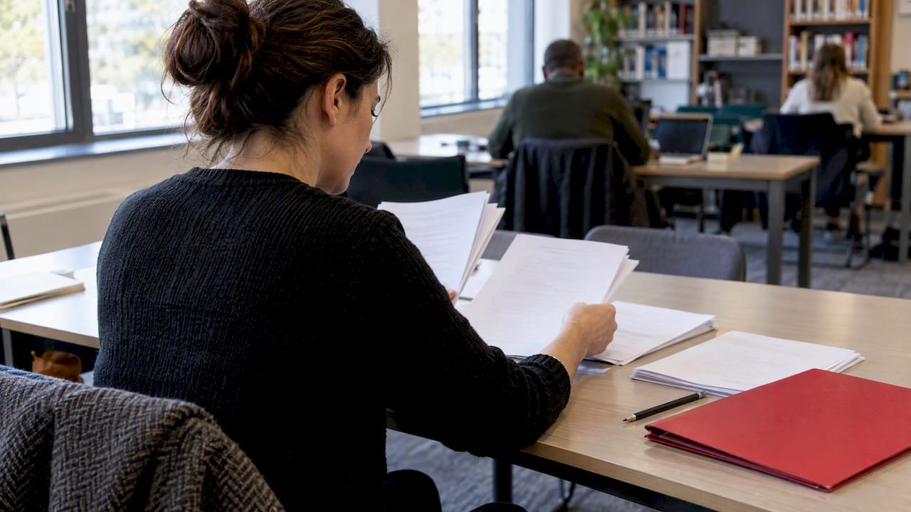 Professional comparing Six Sigma belt exam materials