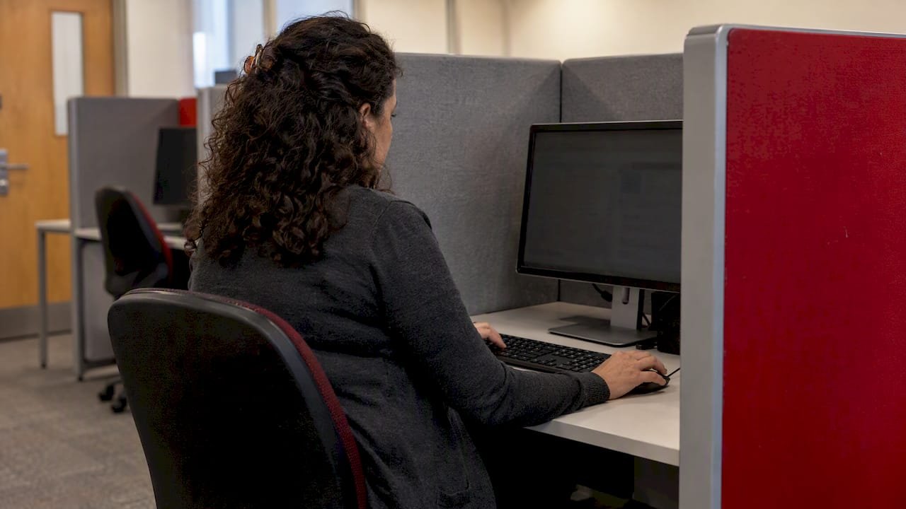 Candidate taking a computer-based certification exam